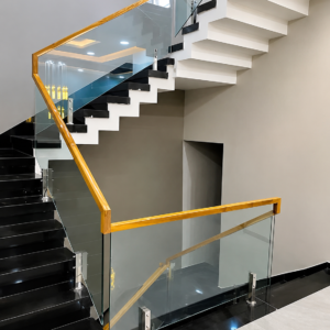 Luxury Gold PVD coated glass railing design for balcony and staircase by Aryan Steel Art