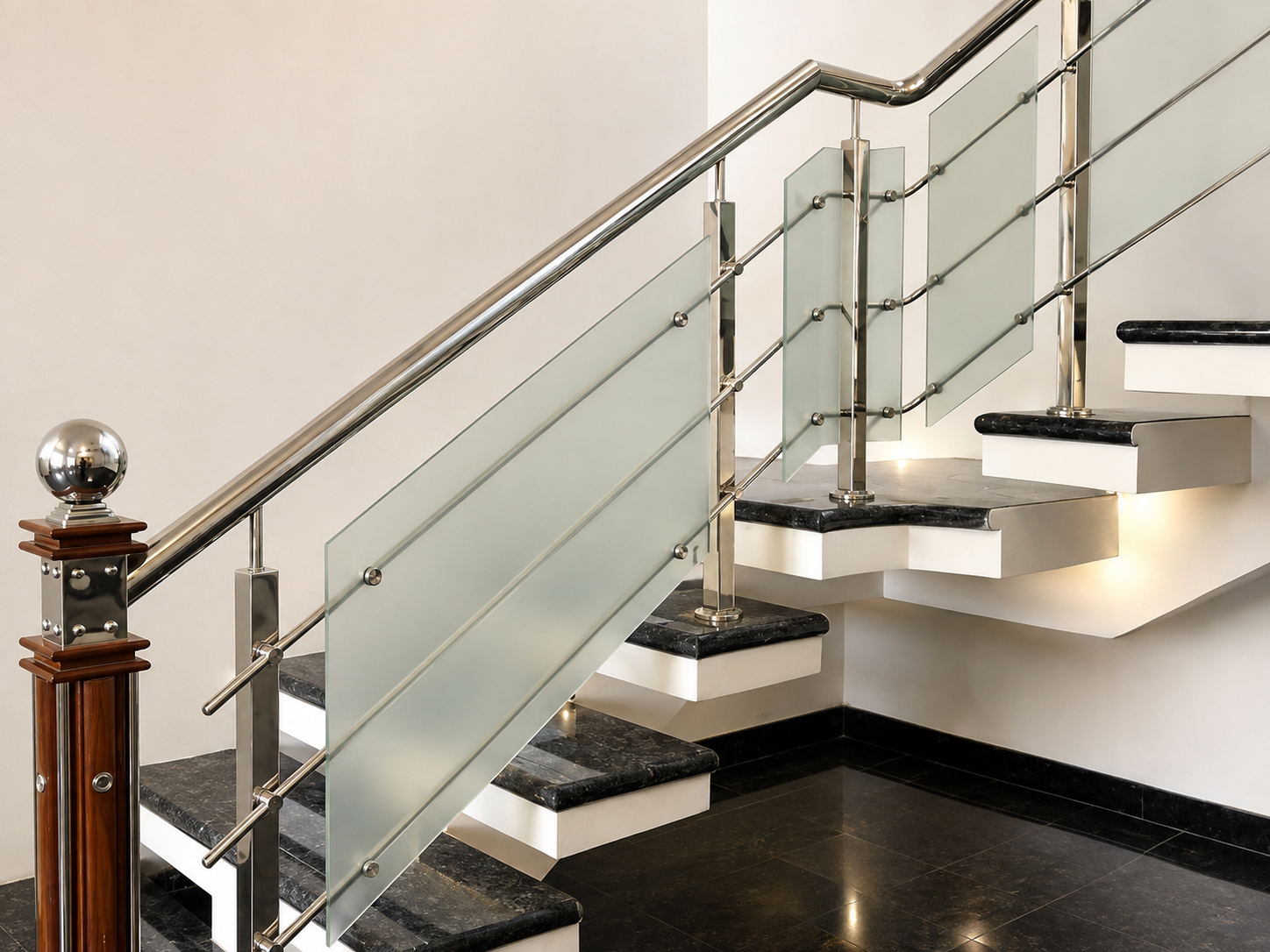Stainless steel stair railing with glass