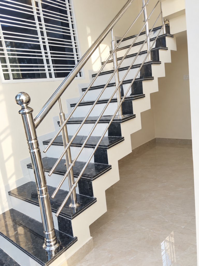 SS staircase railing design with stainless steel horizontal bars and decorative blue balusters